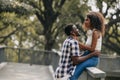 Black african man and women couple lover teen lifestyle living together at park outsoors