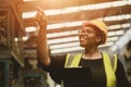 Black African professional women worker happy working count checking inventory production stock control in business factory