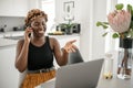 Black African traditional business woman working from home on phone call Royalty Free Stock Photo