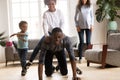 Father ride daughter on his back have a fun indoors Royalty Free Stock Photo