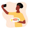 Black african woman food blogger making photo selfie with salmon steak and lemon and rosemary for blog. Cute girl with smartphone