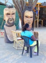 African woman sells wood sculptures market, Okahandja, Namibia