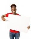 Black afro american man smiling happy and showing a blank billboard Royalty Free Stock Photo