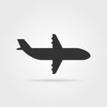 Black airplane icon side view with shadow Royalty Free Stock Photo