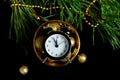 Black Alarm clock and fir tree branch, gold christmas decorations green velours glitte