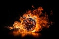 A black alarm clock with large numbers on a dark background surrounded by burning hot particles Royalty Free Stock Photo