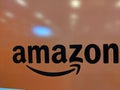 Black Amazon logo on Orange shiny wall Royalty Free Stock Photo