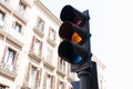 Black amber traffic light on the street