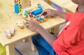 Black American kid play car toy at classroom in kindergarten preschool,Education concept.