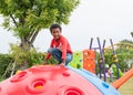 Black americans kid boy having fun to play on children`s climbin Royalty Free Stock Photo