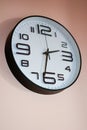 Black analog clock mounted on a wall Royalty Free Stock Photo