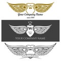 Black angel wings logo set. Vector winged labels with crowns and heraldic shields on background Royalty Free Stock Photo