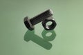Black anodized fasteners on reflective surface Royalty Free Stock Photo