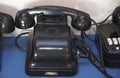 Black antique telephone. Vintage old telephone on desk Royalty Free Stock Photo