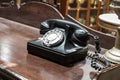Black antique vintage analog telephone dialing. Royalty Free Stock Photo