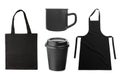 Black apron, tote bag, coffee cup, coffee mug on white Royalty Free Stock Photo