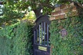 Black Arched Gate Doorway Entrance to Garden