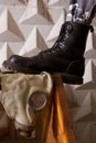 Black army boots standing on gas mask Royalty Free Stock Photo