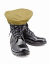 Black army shoes and Beret on white backgrounds Royalty Free Stock Photo