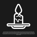 Black Aroma candle icon isolated on black background. Vector