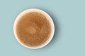 Black aromatic coffee in a paper craft cup on a blue background. Top view. The concept of eco and zero waste. Eco-friendly use. Royalty Free Stock Photo