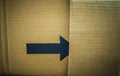 black arrow on a cardboard shipping box for advertisement Royalty Free Stock Photo