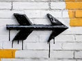 A black arrow painted on a white brick wall Royalty Free Stock Photo
