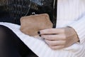 Black art deco crocodile purse and white sweater fashion detail Royalty Free Stock Photo