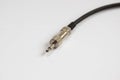 Black audio cable ,chrome jack plug on white backgroun Royalty Free Stock Photo