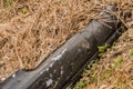 Black automobile bumper on ground