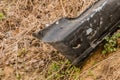 Black automobile bumper on ground