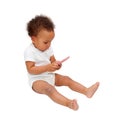 Black baby playing with mobile phone.