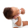 Black baby talking and playing with mobile phone. Royalty Free Stock Photo