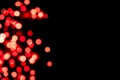 Black background with bright red warm bokeh lights. Holiday, Valentines, Christmas and New Year background. Ideal to