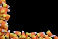 Black Background with Candy Corn Bottom Left Border w Lots of Copyspace Royalty Free Stock Photo