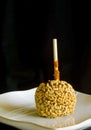 Black background caramel apple