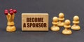 On a black background, chess and a sign with the inscription - BECOME A SPONSOR