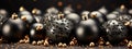 Black Background with Black Christmas Balls and a Swirl of Golden Glitter to Create Festive Atmosphere...Refined Frame on Black Royalty Free Stock Photo