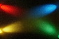 On a black background, crossed counter beams of blue red green and yellow gradient light Royalty Free Stock Photo