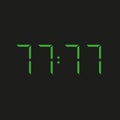 Black background electronic clock with four green numbers and datum 77:77 Ã¢â¬â repeating seventy seven