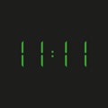 Black background electronic clock with four green numbers and time 11:11 Ã¢â¬â repeating one, eleven