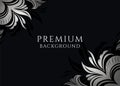 Black background with elegant stylized silver flowers in the corners