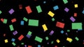 Floating rectangular confetti pieces in red, green, yellow, and blue against a black background, celebration concept. Royalty Free Stock Photo