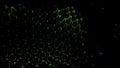 Black background with glass mesh. Design. Yellow and green backlighting on a grid connected to each other that moves in