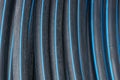 Black blue texture of rubber hoses in skein Royalty Free Stock Photo