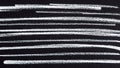 Black background with white crayon stripes