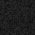 Black Background with White Dots Creating a Subtle Textured Pattern Royalty Free Stock Photo