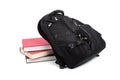 Black backpack with books on white