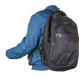 Black backpack dressed in a blue jacket isolated on a white background Royalty Free Stock Photo
