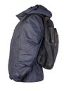 Black backpack dressed in a blue jacket isolated on a white background Royalty Free Stock Photo